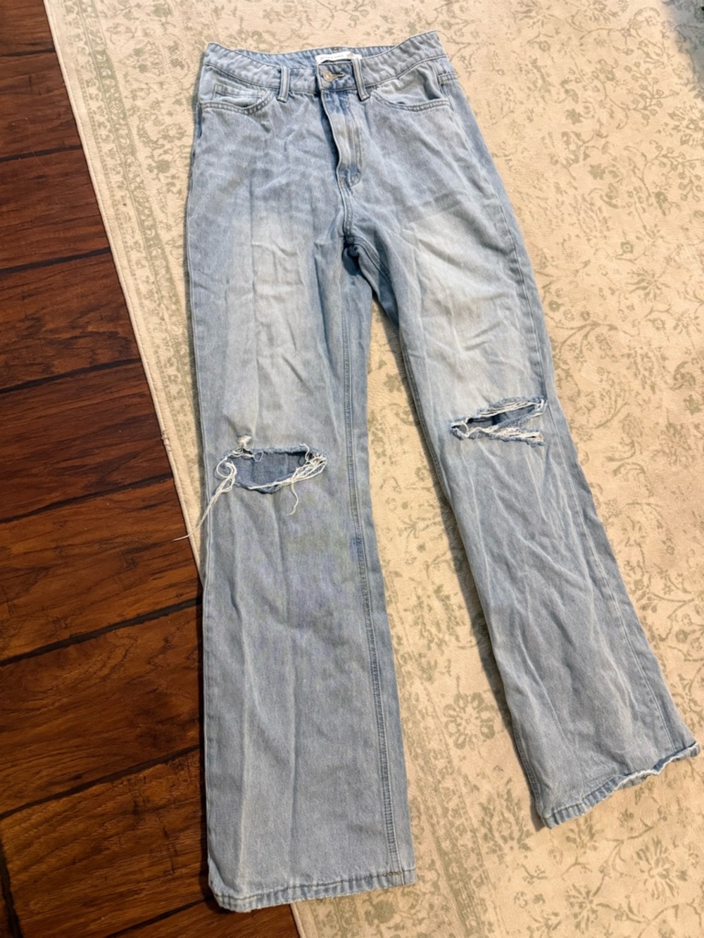 Altar'd State Faded Light Blue Flare Jeans with Knee Rips